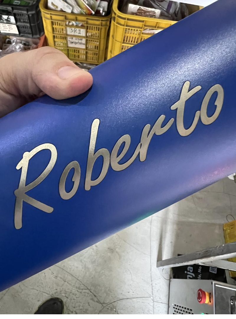 Powder-coated tumbler engraved with a fiber laser